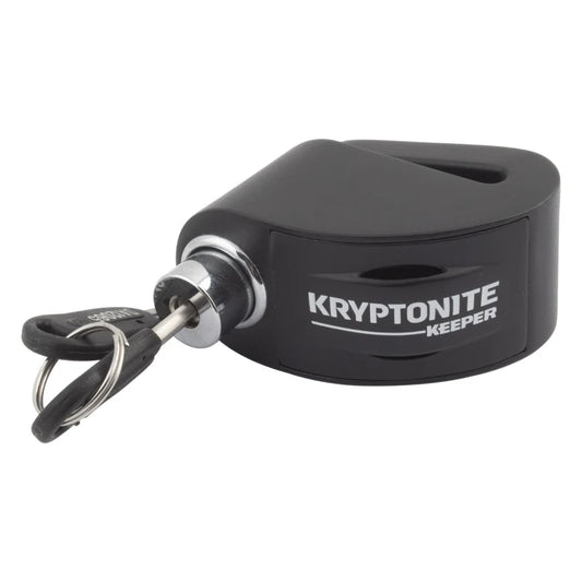 A close-up of an alarm disc keeper device, showing its circular shape and secure locking mechanism designed to prevent unauthorized removal or tampering.