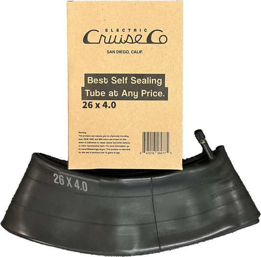 A 26x4 self-sealing eBike inner tube displayed coiled next to its packaging, highlighting its puncture-resistant features.