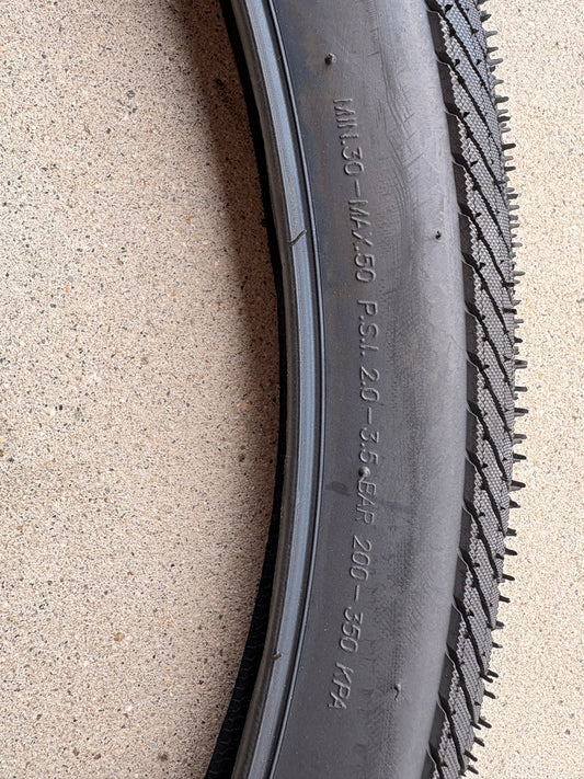 Product image of a Kenda Kwick Seven.5 eBike tire, size 27.5x2.20, showing the tread pattern and sidewall branding.