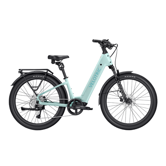A mint green Velotric Discover 3 eBike shown from a side angle, highlighting its step-through frame, integrated battery, and upright handlebars.