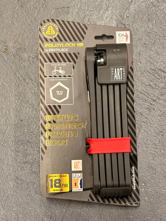 A black eMOTO eBike Lock SEATYLOCK Foldylock 110 displayed folded on a white background, showing its compact design and sturdy construction.
