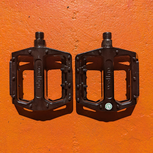 A pair of metal e-bike pedals in a modern, rugged style with a textured surface for enhanced grip and durability.