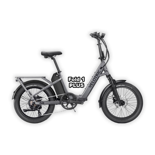 Velotric Fold 1 PLUS eBike in Stone Gray color, folded and placed inside its box, product image showing the bike and packaging.
