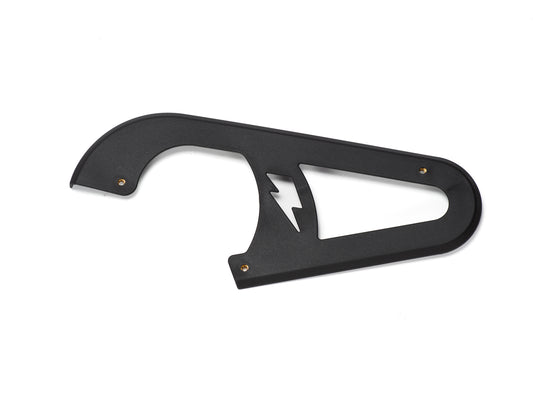 Stomp Ebox Dragster chain guard, black metal component with mounting holes, shown on a white background.
