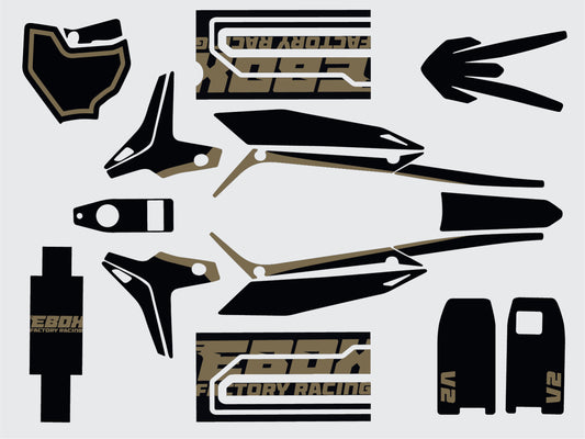 Stomp Ebox V2 Graphics Kit in black, displayed on a white background, showing detailed decals and design elements for motocross bike customization.