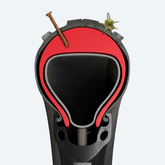 A close-up image of Tannus Armour tire liners, showing the red foam inserts designed to fit inside bicycle tires for added puncture protection.
