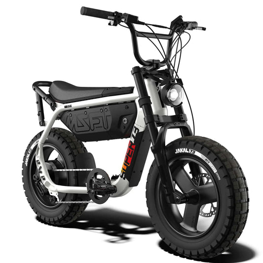 A silver 2027 SE Baja viewed from the front three-quarter angle, showcasing its modern design, LED headlights, and rugged off-road features.