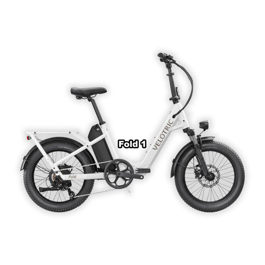 Velotric Fold 1 eBike in pearl white, folded and placed inside its box, product image on a white background