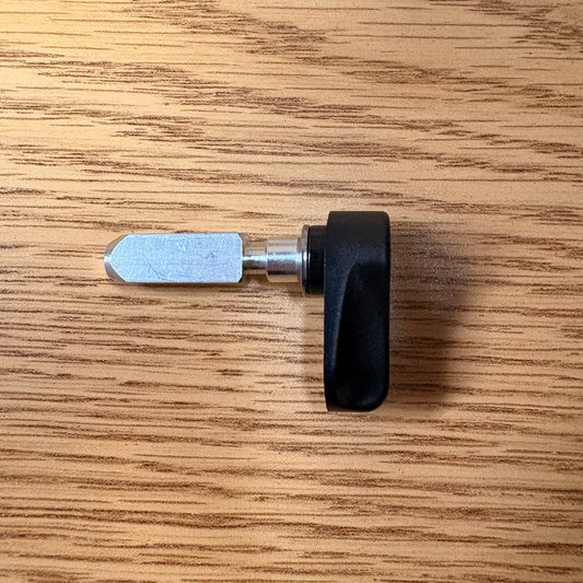 Close-up of the Mokwheel eBike battery release lever attached to the bike frame