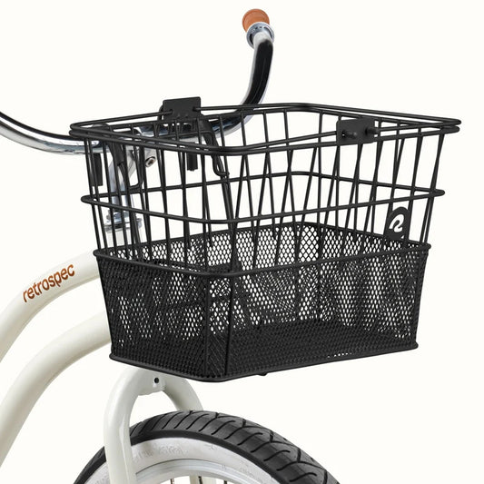 Black Retrospec Apollo steel bike basket attached to the front of an eBike