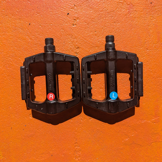 Close-up view of metal eBike pedals in Style 2, showcasing a sturdy, textured surface and durable construction.