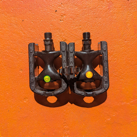 A pair of metal bicycle pedals in Style 6, shown on a white background.