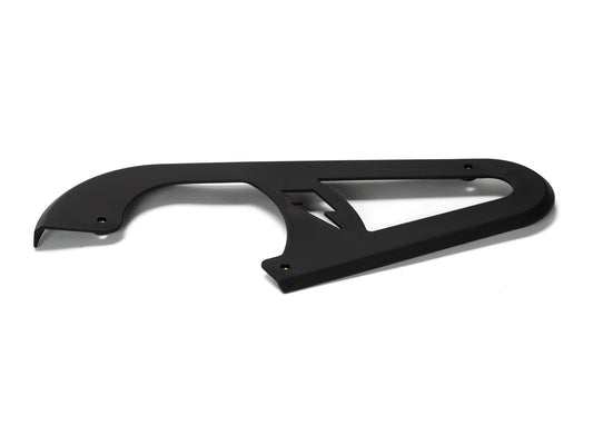 Stomp Ebox Dragster chain guard, black metal component mounted on a motorcycle frame, shown from a side angle against a white background.